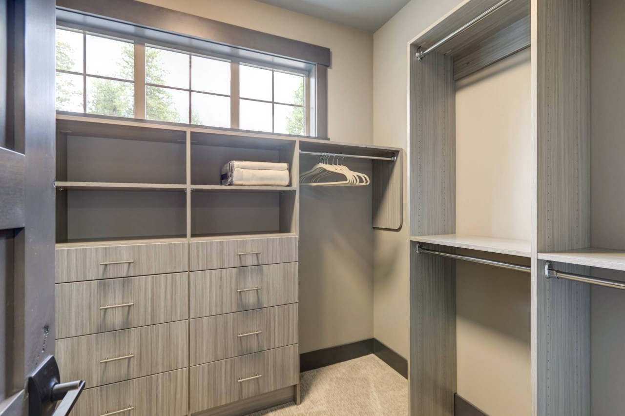  A closet with natural wood furniture and window at Appalachian Blind & Closet Co. near Boone, NC